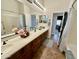 Bathroom boasts dual sinks, a large mirror and tile floors at 4116 E Sierra Sunset Trl, Cave Creek, AZ 85331