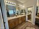 Bathroom featuring double sinks, vanity, mirror, and decorative tiles at 4116 E Sierra Sunset Trl, Cave Creek, AZ 85331