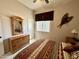 Bedroom with neutral walls, ceiling fan, and southwest-inspired decor at 4116 E Sierra Sunset Trl, Cave Creek, AZ 85331