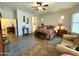 Spacious bedroom features a ceiling fan, comfortable seating area and a stylish southwestern-patterned bedspread at 4116 E Sierra Sunset Trl, Cave Creek, AZ 85331