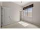 Cozy bedroom with a window allowing for natural light, carpet and closet at 4116 E Sierra Sunset Trl, Cave Creek, AZ 85331
