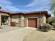 Close up of attractive stone exterior with multi-car garage and landscaped front yard at 4116 E Sierra Sunset Trl, Cave Creek, AZ 85331