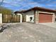 Paver driveway and wooden gate leading to a home with stone accents and a multi-car garage at 4116 E Sierra Sunset Trl, Cave Creek, AZ 85331