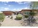 Beautiful desert home with stone accents and well-manicured landscaping at 4116 E Sierra Sunset Trl, Cave Creek, AZ 85331