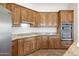 Kitchen with stainless steel appliances, granite counters, and ample wood cabinetry at 4116 E Sierra Sunset Trl, Cave Creek, AZ 85331