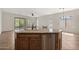 Kitchen island with sink, stainless steel dishwasher, and granite countertops at 4116 E Sierra Sunset Trl, Cave Creek, AZ 85331