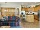 Open concept kitchen with custom cabinets, large island, stainless appliances flows to the living area at 4116 E Sierra Sunset Trl, Cave Creek, AZ 85331