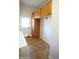 The laundry room features tile flooring and convenient storage cabinetry, with access to the outside at 4116 E Sierra Sunset Trl, Cave Creek, AZ 85331
