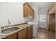 Well-lit laundry room with cabinets and full size washer and dryer at 4116 E Sierra Sunset Trl, Cave Creek, AZ 85331