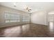 Spacious living room features tile floors, ceiling fan, and large windows for natural light at 4116 E Sierra Sunset Trl, Cave Creek, AZ 85331