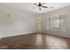 Open living room with tile floors, a ceiling fan, and bright windows at 4116 E Sierra Sunset Trl, Cave Creek, AZ 85331