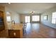 Open concept living room showcasing tile flooring, a kitchen island, and natural light from sliding doors at 4116 E Sierra Sunset Trl, Cave Creek, AZ 85331