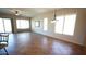 Bright living room featuring tile flooring, large windows with blinds, and a ceiling fan at 4116 E Sierra Sunset Trl, Cave Creek, AZ 85331