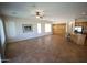 Open living room featuring tile flooring, neutral walls, ample natural light, and seamless access to the kitchen at 4116 E Sierra Sunset Trl, Cave Creek, AZ 85331