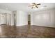 Living space with neutral paint, ceiling fan, tile floors, and arched doorways at 4116 E Sierra Sunset Trl, Cave Creek, AZ 85331