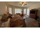 Spacious main bedroom with a ceiling fan, sitting area, and access to the back patio at 4116 E Sierra Sunset Trl, Cave Creek, AZ 85331