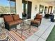 Inviting covered patio with comfortable seating area and vibrant outdoor rug at 4116 E Sierra Sunset Trl, Cave Creek, AZ 85331