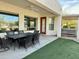 Covered patio with outdoor dining table and chairs, perfect for entertaining guests at 4116 E Sierra Sunset Trl, Cave Creek, AZ 85331