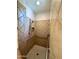 Accessible tiled shower featuring grab bars and adjustable shower head at 4116 E Sierra Sunset Trl, Cave Creek, AZ 85331