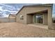 Low-maintenance backyard featuring a gravel landscape and a covered patio at 4240 W Crossflower Ave, San Tan Valley, AZ 85144