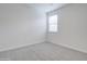 Bedroom featuring neutral carpet, white walls and window at 4240 W Crossflower Ave, San Tan Valley, AZ 85144