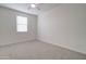Bedroom featuring neutral carpet, a window and white walls at 4240 W Crossflower Ave, San Tan Valley, AZ 85144