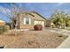 Charming single-story home showcasing desert landscaping and attached two-car garage at 4240 W Crossflower Ave, San Tan Valley, AZ 85144