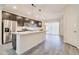 Open concept kitchen with sleek stainless steel appliances and granite countertops at 4240 W Crossflower Ave, San Tan Valley, AZ 85144