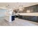 Spacious kitchen featuring stainless steel appliances, granite counters, and modern pendant lighting at 4240 W Crossflower Ave, San Tan Valley, AZ 85144