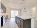 Well-equipped kitchen featuring a center island with seating, perfect for casual dining at 4240 W Crossflower Ave, San Tan Valley, AZ 85144