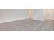 Bright living room featuring vinyl flooring, white walls, and entryway at 4240 W Crossflower Ave, San Tan Valley, AZ 85144
