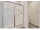 White shower stall with glass doors and nickel hardware at 4240 W Crossflower Ave, San Tan Valley, AZ 85144