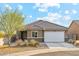 Charming single-story home featuring a tile roof, neutral stucco, and a two-car garage on a cul-de-sac at 431 W Guinea Ct, Casa Grande, AZ 85122