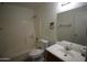 Bathroom with shower-tub combination, vanity, and large mirror at 4409 E Wood St, Phoenix, AZ 85040