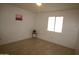 Bright, neutral bedroom with tile flooring and natural light at 4409 E Wood St, Phoenix, AZ 85040
