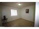 A naturally lit bedroom with tile floors and small decor accents at 4409 E Wood St, Phoenix, AZ 85040