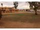 Well-maintained community grounds with mature trees, ample parking, and charming residential buildings at 4409 E Wood St, Phoenix, AZ 85040
