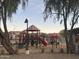 Community playground with multiple play structures, slides, and covered areas at 4440 S Leisure Way, Gilbert, AZ 85297