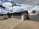 Charming single-story brick home with a two-car garage and desert landscaping at 4524 W Larkspur Dr, Glendale, AZ 85304