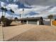 Attractive single-story home with desert landscaping and a grey two-car garage at 4524 W Larkspur Dr, Glendale, AZ 85304