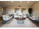 Comfortable living room with a neutral palette, a round wood coffee table, and recessed lighting at 4524 W Larkspur Dr, Glendale, AZ 85304
