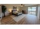 Relaxing bedroom with a ceiling fan, sliding glass door, and modern decor at 4524 W Larkspur Dr, Glendale, AZ 85304