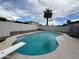 Inviting swimming pool with diving board and modern stone deck at 4524 W Larkspur Dr, Glendale, AZ 85304