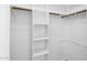 Well-organized walk-in closet with built-in shelving and hanging rods at 4533 N 22Nd St # 228, Phoenix, AZ 85016
