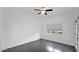 Bedroom with dark hardwood floors and sunlit window, creating a bright and welcoming space at 4533 N 22Nd St # 228, Phoenix, AZ 85016