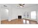 A bright living area features a ceiling fan, a fireplace and French doors at 4533 N 22Nd St # 228, Phoenix, AZ 85016