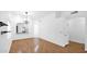 Open living room with hard wood flooring and modern light fixture and a large window at 4533 N 22Nd St # 228, Phoenix, AZ 85016