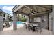 Community pool area features shaded seating, a ceiling fan, lounge chairs, and well-maintained landscaping at 4533 N 22Nd St # 228, Phoenix, AZ 85016