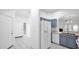 Open kitchen featuring white appliances, blue cabinets, and tile flooring at 4533 N 22Nd St # 228, Phoenix, AZ 85016