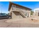 Two story home with a parking area in front of the building at 4714 E Belleview St, Phoenix, AZ 85008
